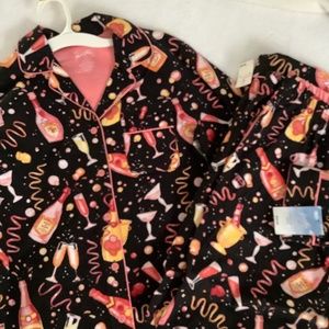 NWT Nick and Nora Flannel Pajamas.  Champagne bottles and flutes.  Size small